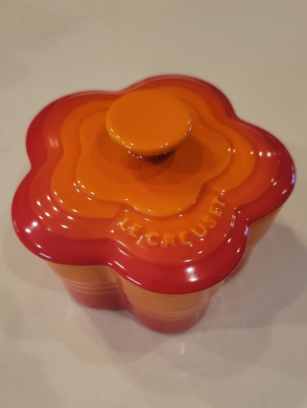 Le Creuset Flower-Shaped Stoneware Cocotte in Flame Orange